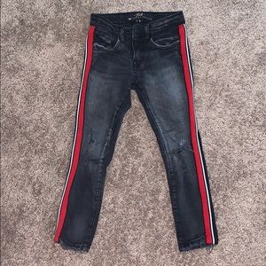 Kids skinny faded black ripped jeans with stripes